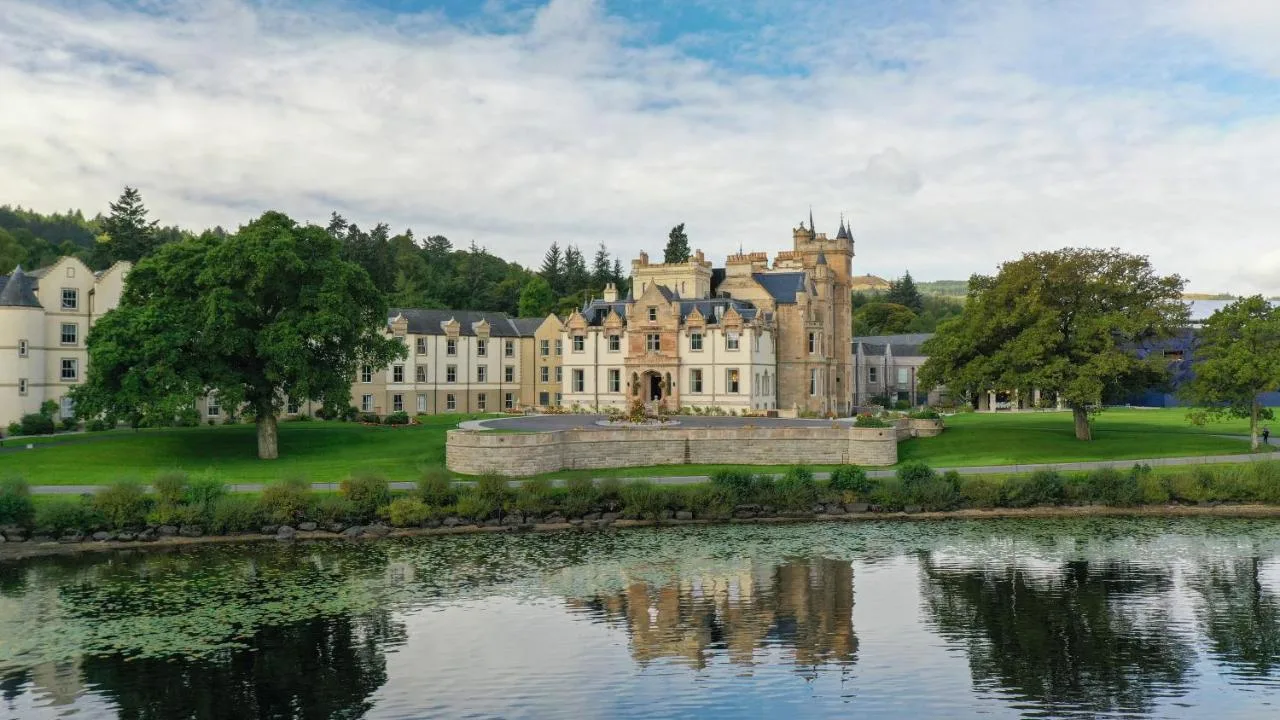 Cameron House reflected in the loch