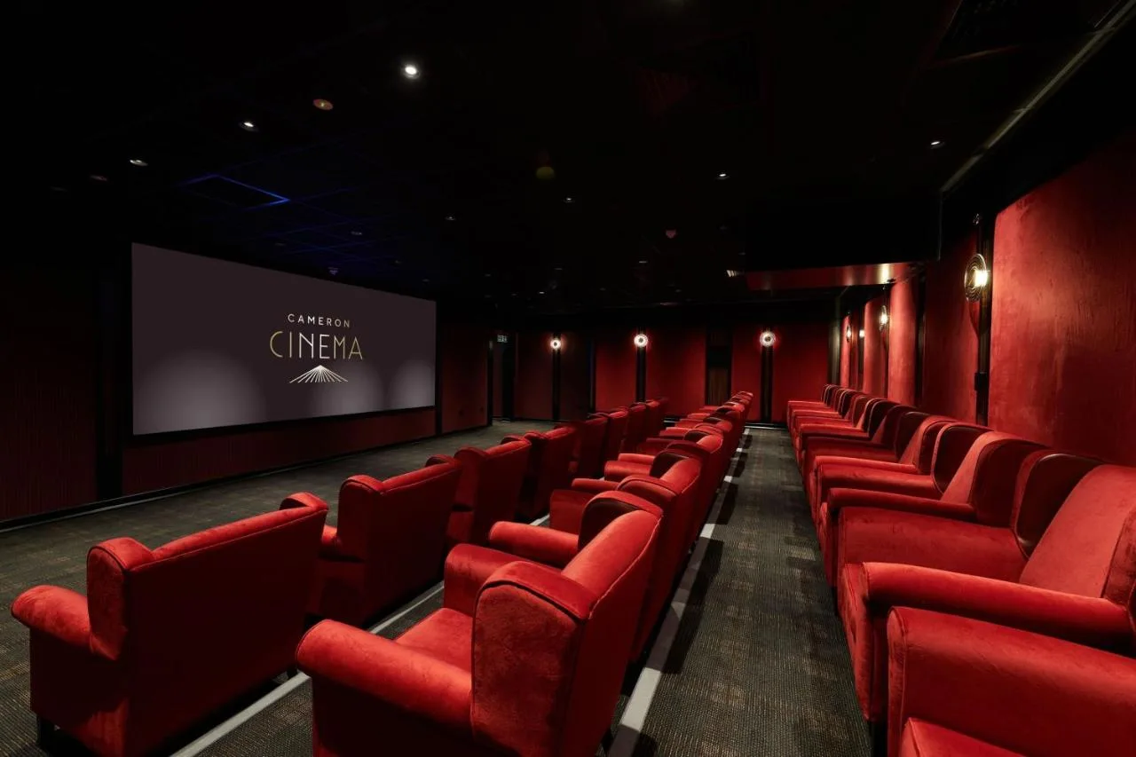 Hotel cinema with red seats